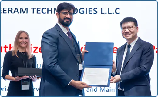 Meeram Technologies and Huawei executives clapping on stage in front of a screen announcing Meeram Technologies LLC as an authorized service partner.