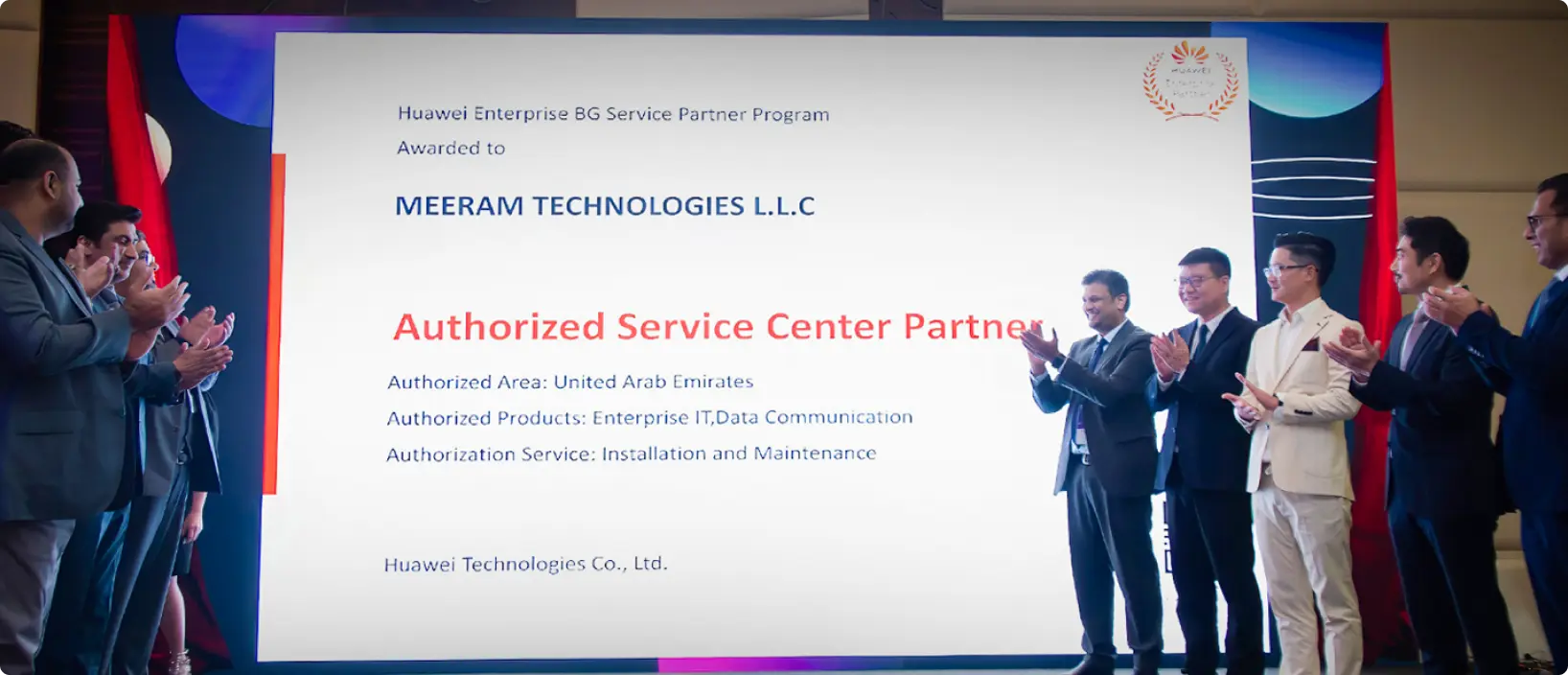 Meeram Technologies and Huawei executives clapping on stage in front of a screen announcing Meeram Technologies LLC as an authorized service partner. 